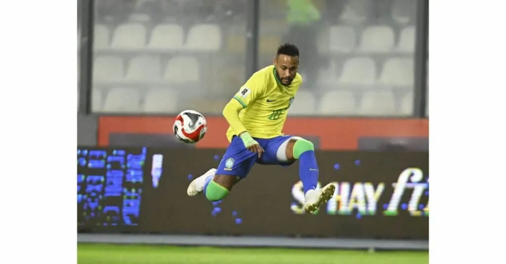 A CONMEBOL soccer player kicking the ball in the air during World Cup qualifying.